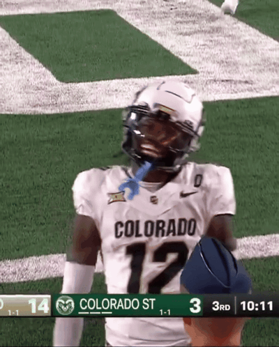 A Football Player Wearing A Colorado Jersey Is Standing On The Field GIF