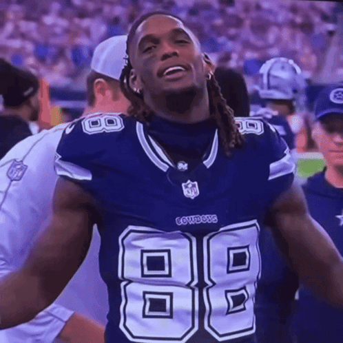 A Football Player Wearing A Cowboys Jersey With The Number 88 On It GIF