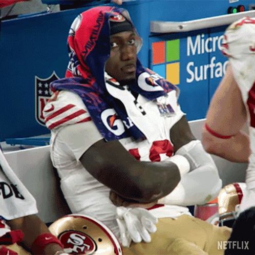 A Football Player Wearing A Gatorade Towel Around His Neck GIF