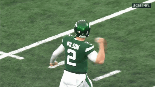 A Football Player Wearing A Green Jersey With The Number 2 On It GIF