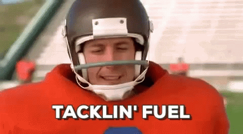 A Football Player Wearing A Helmet And A Red Jersey Is Talking About Tacklin ' Fuel . GIF