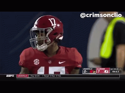 A Football Player Wearing A Helmet And Number 14 Jersey GIF