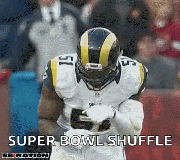 A Football Player Wearing A Helmet And Number 15 Is Running On The Field . GIF