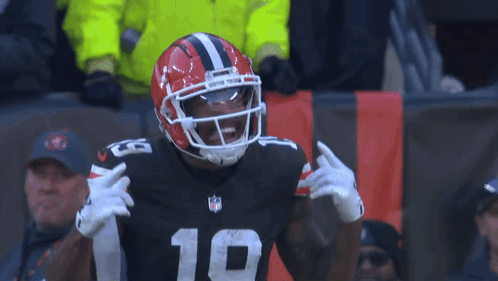 a football player wearing a helmet and number 19 on his jersey
