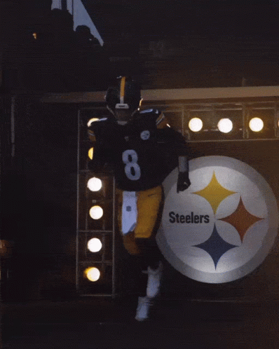 A Football Player Wearing A Helmet And Number 8 On His Jersey GIF