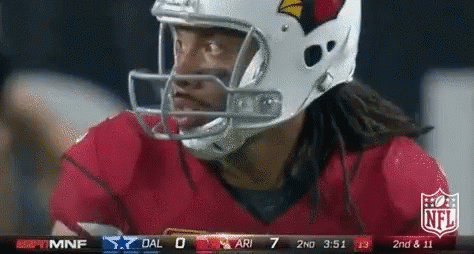 A Football Player Wearing A Helmet Looks At The Scoreboard GIF