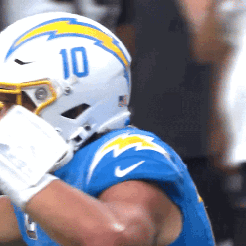 A Football Player Wearing A Helmet That Says 10 GIF