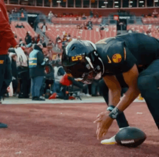 A Football Player Wearing A Helmet That Says Lp On It GIF