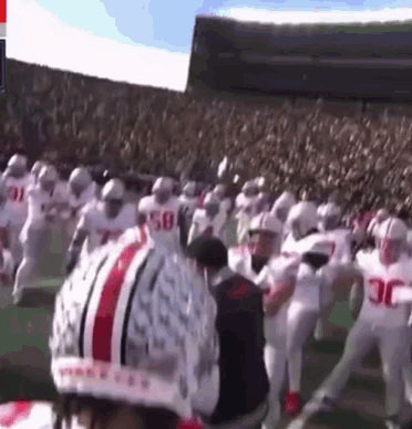 A Football Player Wearing A Helmet That Says Ohio State On It GIF