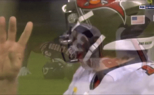 A Football Player Wearing A Helmet That Says Pro Falcons GIF