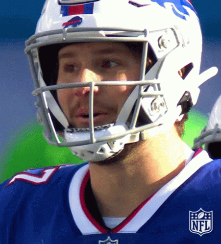 A Football Player Wearing A Helmet With The Nfl Logo On His Chest GIF