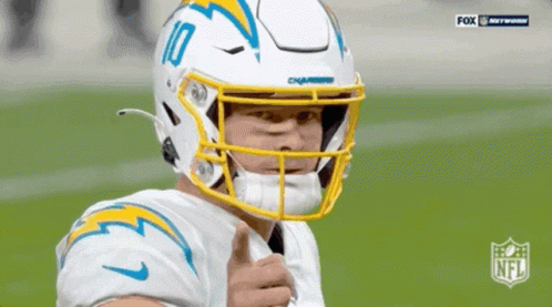 A Football Player Wearing A Helmet With The Number 10 On It GIF