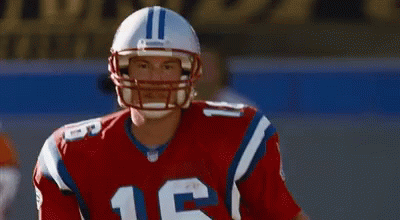 A Football Player Wearing A Helmet With The Number 16 On It GIF
