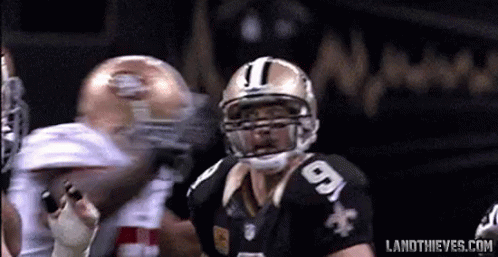 A Football Player Wearing A Helmet With The Number 9 On It GIF