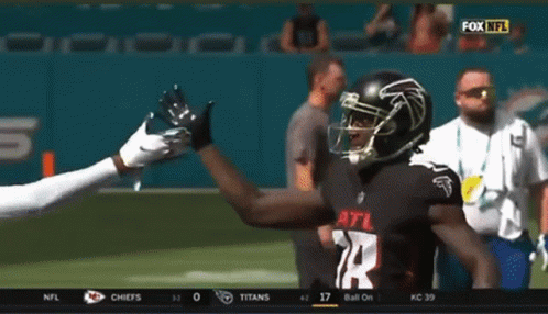 A Football Player Wearing A Jersey With The Number 24 On It GIF