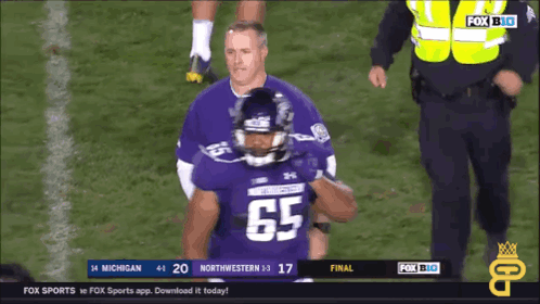 a football player wearing a jersey with the number 65
