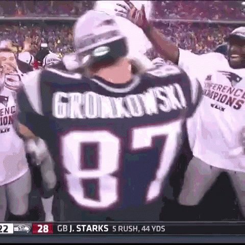 A Football Player Wearing A Jersey With The Number 87 GIF
