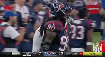 A Football Player Wearing A Jersey With The Number 90 On It GIF