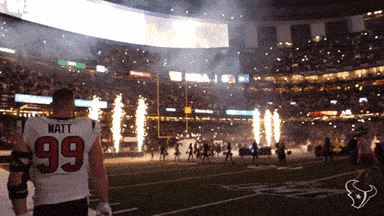 A Football Player Wearing A Jersey With The Number 99 GIF