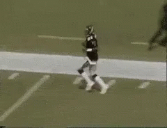 A Football Player Wearing A Number 1 Jersey Is Running On The Field GIF