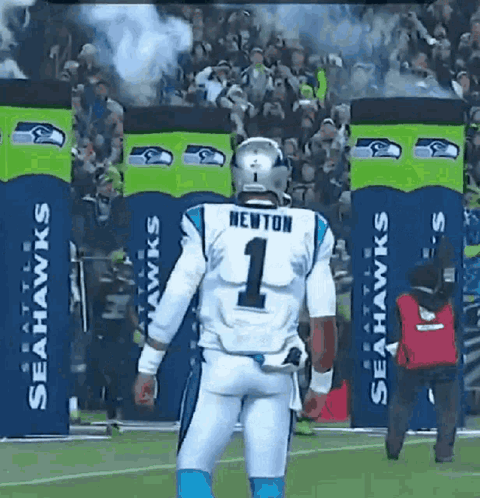 A Football Player Wearing A Number 1 Jersey Is Walking On The Field GIF