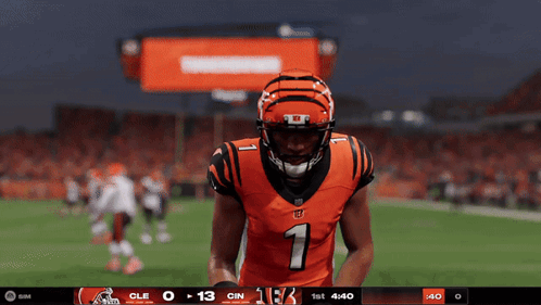 A Football Player Wearing A Number 1 Jersey Stands On A Field GIF