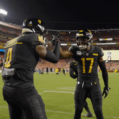 A Football Player Wearing A Number 17 Jersey High Fives Another Player Wearing A Number 4 Jersey GIF