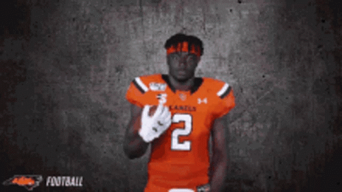 A Football Player Wearing A Number 2 Jersey GIF