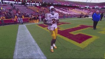 A Football Player Wearing A Number 2 Jersey Is Running On The Field GIF