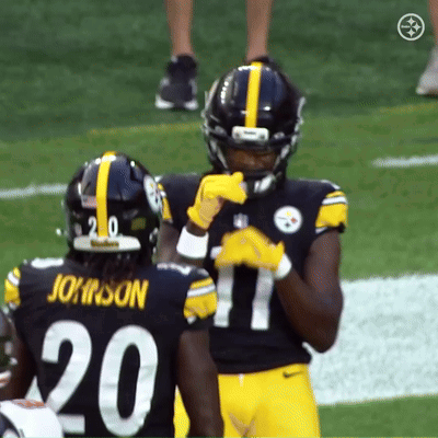 A Football Player Wearing A Number 20 Jersey Stands Next To Another Player Wearing A Number 17 Jersey GIF