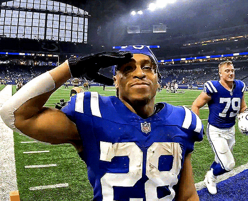A Football Player Wearing A Number 29 Jersey Salutes GIF