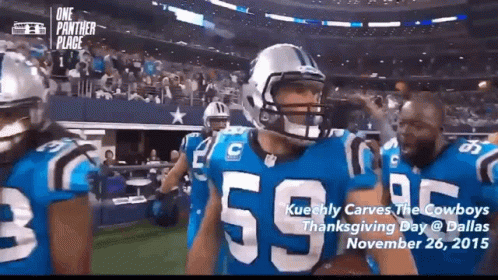 A Football Player Wearing A Number 55 Jersey Stands On The Field GIF