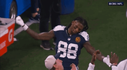 A Football Player Wearing A Number 88 Jersey GIF
