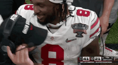 A Football Player Wearing A Number 9 Jersey Is Kneeling Down GIF