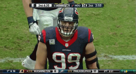 A Football Player Wearing A Number 99 Jersey Stands On The Field GIF