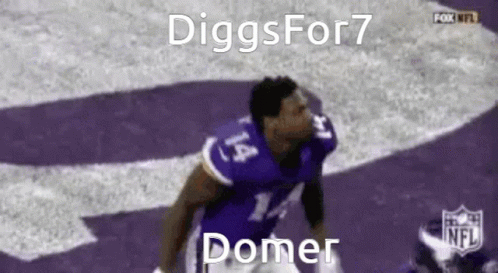A Football Player Wearing A Purple Jersey With The Number 14 On It Is Jumping In The Air . GIF