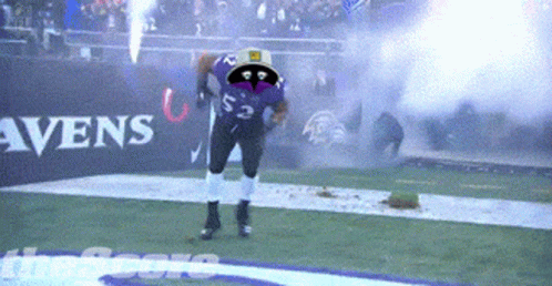 A Football Player Wearing A Purple Jersey With The Number 22 On It GIF