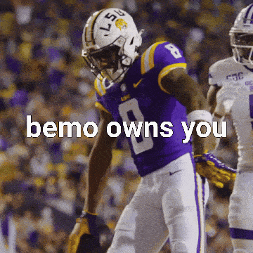 A Football Player Wearing A Purple Uniform With The Number 8 On It GIF
