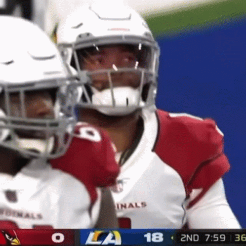 A Football Player Wearing A Red And White Uniform With The Number 18 On It GIF