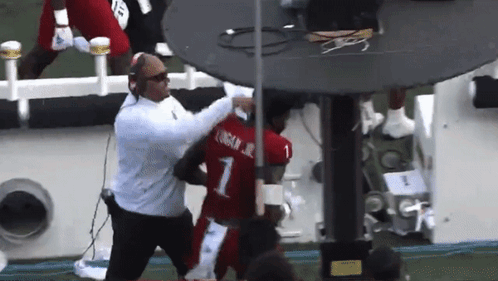 A Football Player Wearing A Red Jersey With The Number 1 On It GIF
