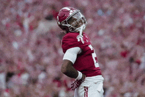 A Football Player Wearing A Red Jersey With The Number 1 On The Front GIF