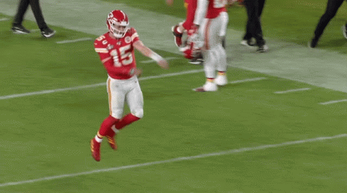 A Football Player Wearing A Red Jersey With The Number 15 On It GIF