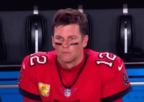 a football player wearing a red jersey with the number 21 on it