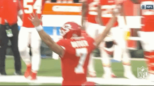a football player wearing a red jersey with the number 7 on it