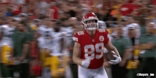 A Football Player Wearing A Red Jersey With The Number 89 On It GIF