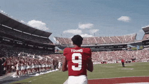a football player wearing a red jersey with the number 9