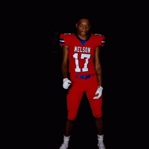 A Football Player Wearing A Red Uniform With Nelson 17 On The Front GIF