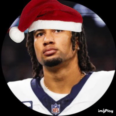 A Football Player Wearing A Santa Hat And A Nfl Jersey . GIF