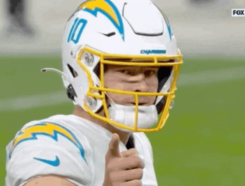A Football Player Wearing A White Helmet With The Number 10 On It GIF