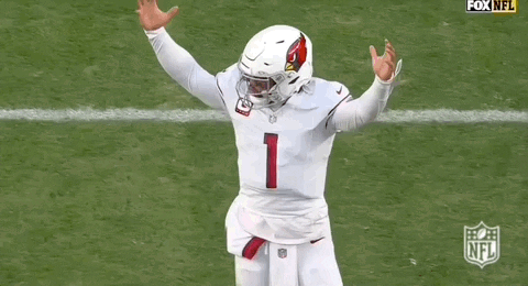 A Football Player Wearing A White Jersey With The Number 1 On It Is Running On The Field . GIF